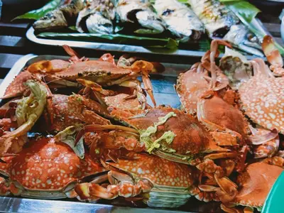 a pile of crabs and other seafood on a table at Patcharin Home Stay in Ko Yao Yai