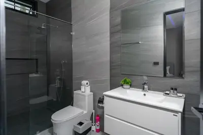 a bathroom with a toilet and a sink and a shower at Diamond 1 Villa by G Estate Phuket in Ban Saiyuan (1)