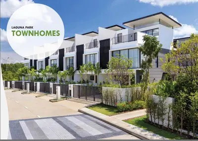 a building with a sign that reads townhomes at Laguna Park 3BR Townhouse BangTao in Laguna Phuket