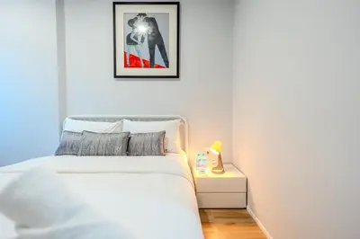 a bedroom with a bed and a picture on the wall at ZcapeX2 94-18 by Silqstay in Thalang