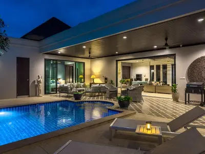 a house with a swimming pool in a yard at Villa Intira 5 bedrooms with 12m private pool and garden in Rawai Beach