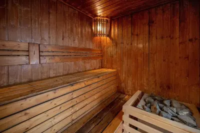 an empty wooden sauna with a bench in it at New Years Super Fancy 2br Villa near Cafe Del Mar in Kamala Beach
