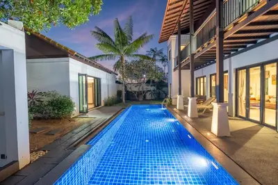 an infinity pool in the backyard of a villa at Pasak Villa in Laguna Phuket