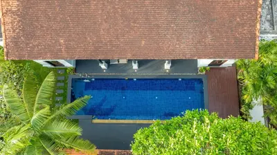 an overhead view of a building with a swimming pool at Pasak Villa in Laguna Phuket