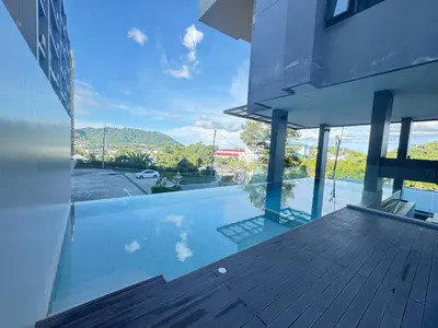 a view from the balcony of a house at Utopia Central Kathu Condo in Phuket Town