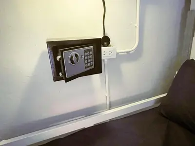 a electrical outlet on a wall in a room at Babyshark Hostel - Loh Dalum Bay in Phi Phi Don