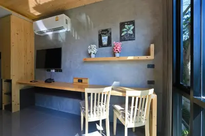a home office with a desk and chairs at ReLife The Windy Condo B218 Naiharn in Rawai Beach