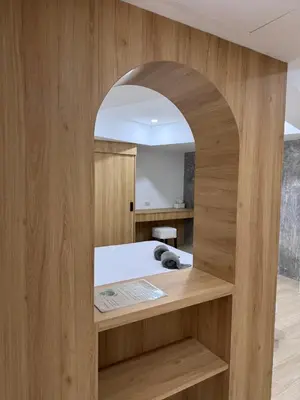 a room with a bed with an archway at Cozy room Maikhao Phuket in Ban Ao Tu Khun