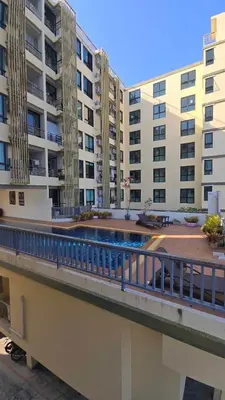 a balcony of a apartment building with a swimming pool at The feeltrue phuket CK in Phuket Town