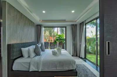 a bedroom with a large bed and a large window at Luxury Seaview Villa 6BR - Villa Shine in Ban Saiyuan (1)
