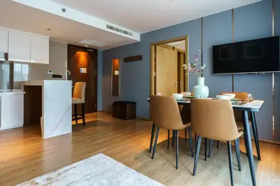 a kitchen and dining room with a table and chairs at 1Bd Сomfortable Apartment LaVita in Phuket Town