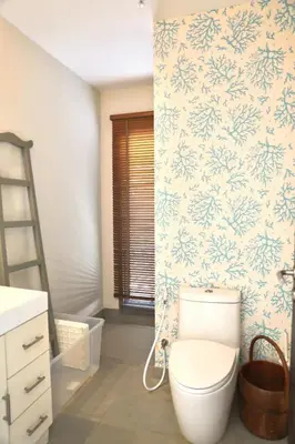 a bathroom with a toilet and a ladder at Villa Kirana in Rawai Beach