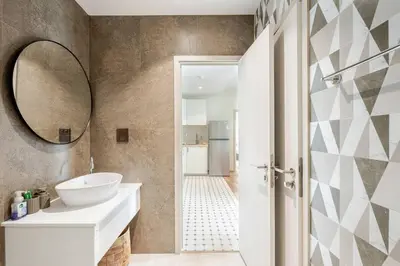 a bathroom with a sink and a mirror at The Title Halo1 2Bedroom Apartment Naiyang beach in Nai Yang Beach