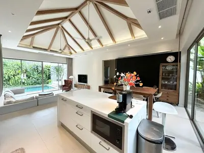 a large kitchen with white cabinets and a large window at V164 Famous 5 Trichada Resort 4-Bedroom in Thalang