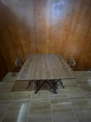 a wooden table sitting on the floor in a room at Lamai home 4 in Ko Yao Noi
