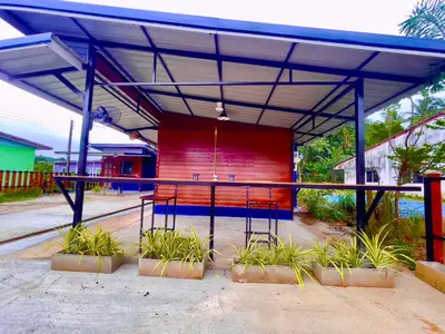 a pavilion with a table and chairs under it at Lamai home 4 in Ko Yao Noi