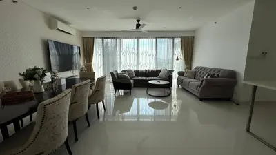 a living room with a couch and a table at Lake view apartment in Laguna in Bang Tao Beach