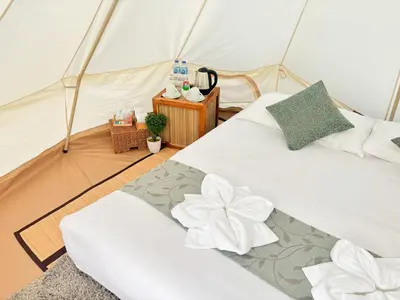 a bedroom with two beds in a tent at Thailand Mountain Phuket in Patong Beach