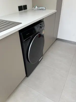 a black dishwasher in a kitchen under a counter at Grand View Residences Lagoon Private Villa, 3BD in Ban Thalat Choeng Thale