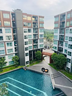 an apartment complex with a swimming pool and buildings at Pool View Apartments-Kathu,Phuket in Kathu