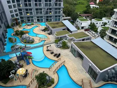 an aerial view of a water park in a city at 1-bedroom apartment Naiharn Beach B403 in Rawai Beach