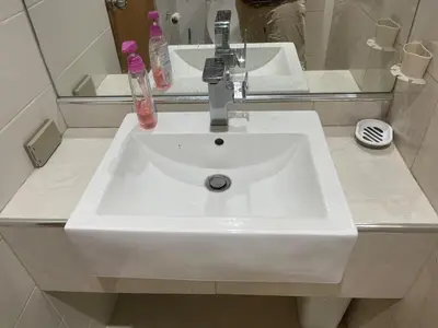 a white sink in a bathroom with a mirror at Two Room MiamiStyle Perfect for Digital Nomads in Ban Saiyuan (1)