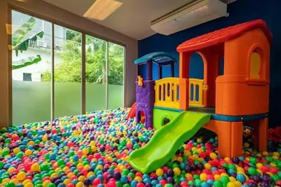 a childs play room with a toy heap of balls at Exquisite Sea View Luxury Apartment Veloche group in Karon Beach