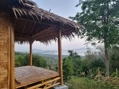 a hut with a thatched roof with a view at Sea True Valley Phuket ซี ทรู วัลเลย์ ภูเก็ต in Ban Ao Makham