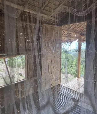 an inside view of a bamboo house with a window at Sea True Valley Phuket ซี ทรู วัลเลย์ ภูเก็ต in Ban Ao Makham