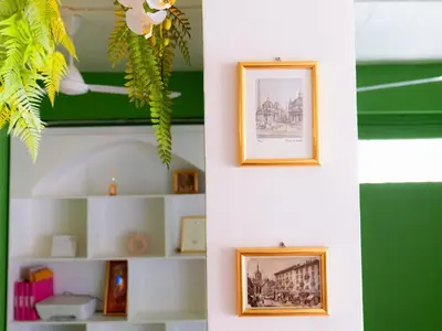 a room with two pictures on the wall at I Talay phuket in Karon Beach