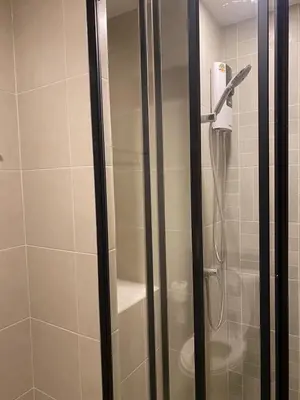 a shower with a glass door in a bathroom at Dcondo - Kathu, Phuket in Kathu