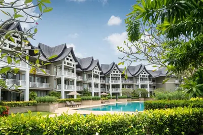 an exterior view of a resort with a swimming pool at Allamanda Premium Apartments Laguna Phuket in Laguna Phuket