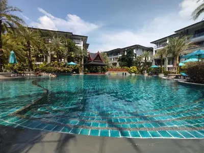 a large swimming pool at a resort at Suite of Naithon beachfront apartment in Nai Thon Beach