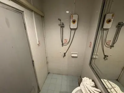 a bathroom with a shower and a toilet at At bedroom in Patong Beach