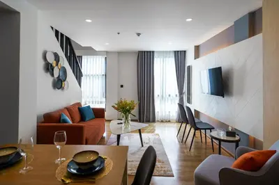 a living room with a couch and a table at Amazing View Duplex La Vita in Phuket Town