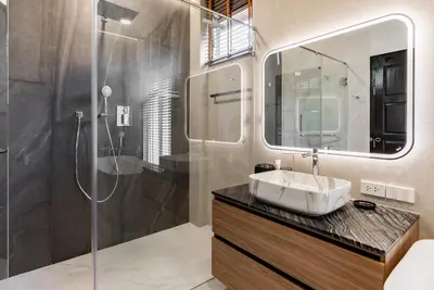 a bathroom with a sink and a shower at Med Village by Villacarte in Nai Harn Beach