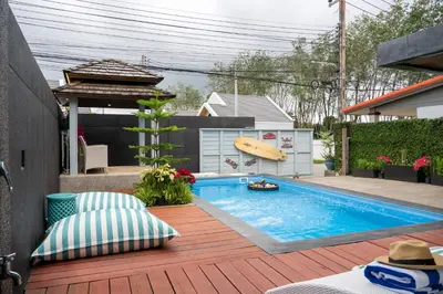 a swimming pool with a surfboard in a backyard at 2 bedrooms Amani Pool Villa Phuket in Thalang