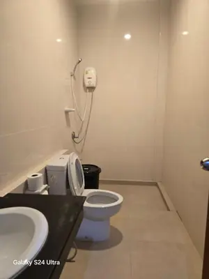a bathroom with a toilet and a sink at NW House in Ao Nang Beach