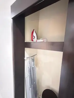 a shelf in a bathroom with a toy car on it at Baan Chom View Residences in Kamala Beach