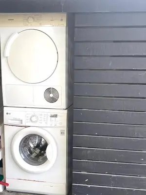 a washing machine sitting next to a wall at Naiharn Beach 3 bedrooms villa in Rawai Beach