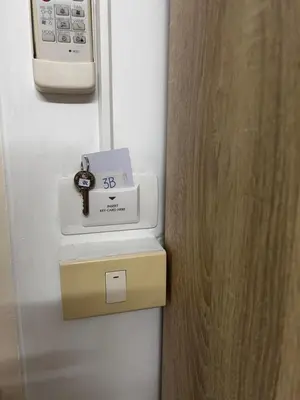 a scale on a wall next to a door at Sleepwell at naiyang No2 in Nai Yang Beach