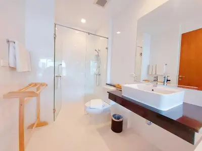 a bathroom with a sink and a toilet and a shower at VIP Suite Residence At Tubkaak Beach, Krabi in Ban Ko Kwang