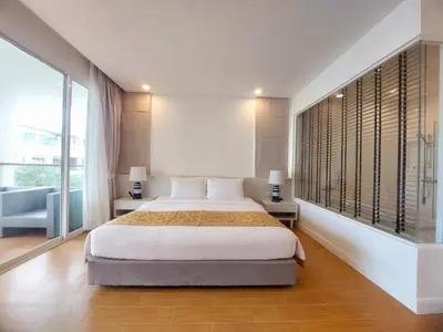 a bedroom with a bed and a large window at VIP Suite Residence At Tubkaak Beach, Krabi in Ban Ko Kwang