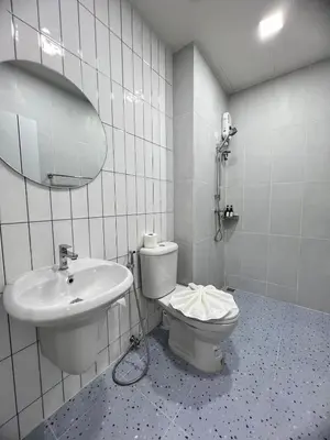 a bathroom with a toilet and a sink at Kata walk&wave hostel in Kata Beach