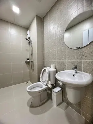 a bathroom with a toilet and a sink at Kata walk&wave hostel in Kata Beach
