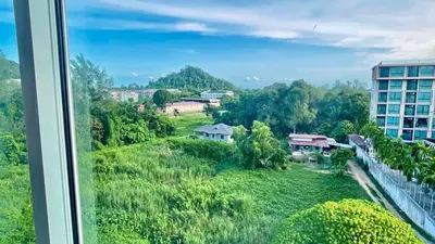 a view from the window of a building at spacious and modern Apartment in Ao Nang in Ban Khlong Haeng