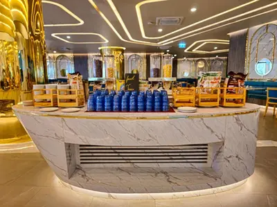 a lobby with a counter with blue bottles on it at Super 2Bdr Apartament La Vita Rawai Naiharn beach in Rawai Beach