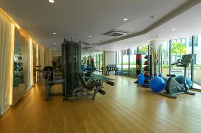 a gym with treadmills and exercise equipment in a building at Family 2 Bdr Suite in La Vita Rawai in Rawai Beach