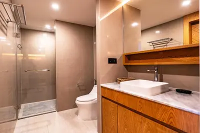 a bathroom with a toilet and a sink and a shower at Family 2 Bdr Suite in La Vita Rawai in Rawai Beach