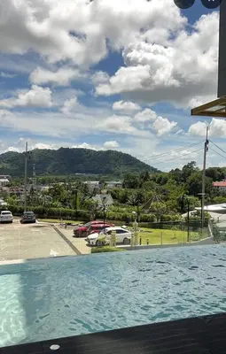 a pool with a view of a parking lot at Utopia Kathu Condo in Phuket Town